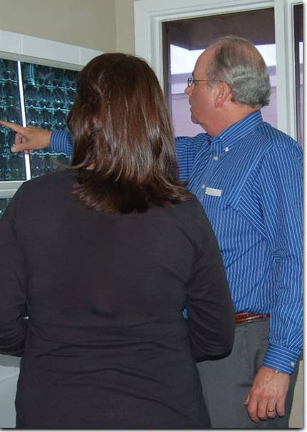 Dr. Barnett showing client chiropractic treatment plan